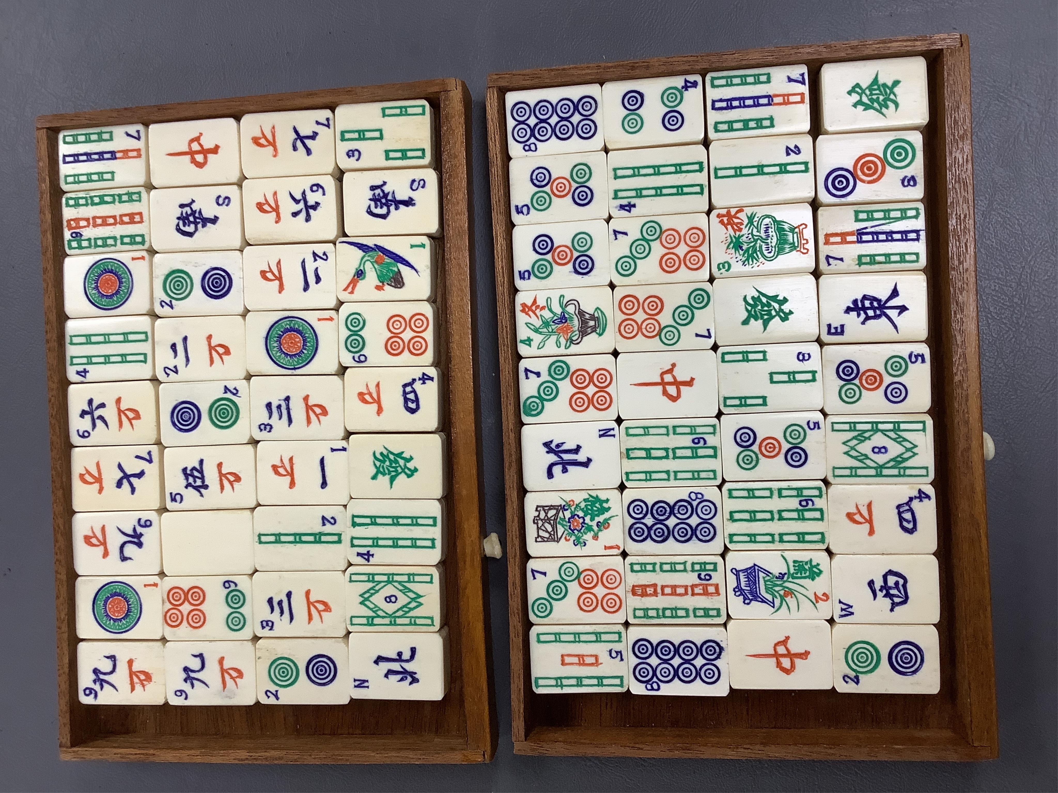 A Chinese carved boxed mahjong set and stands, box 24 cm high including handle